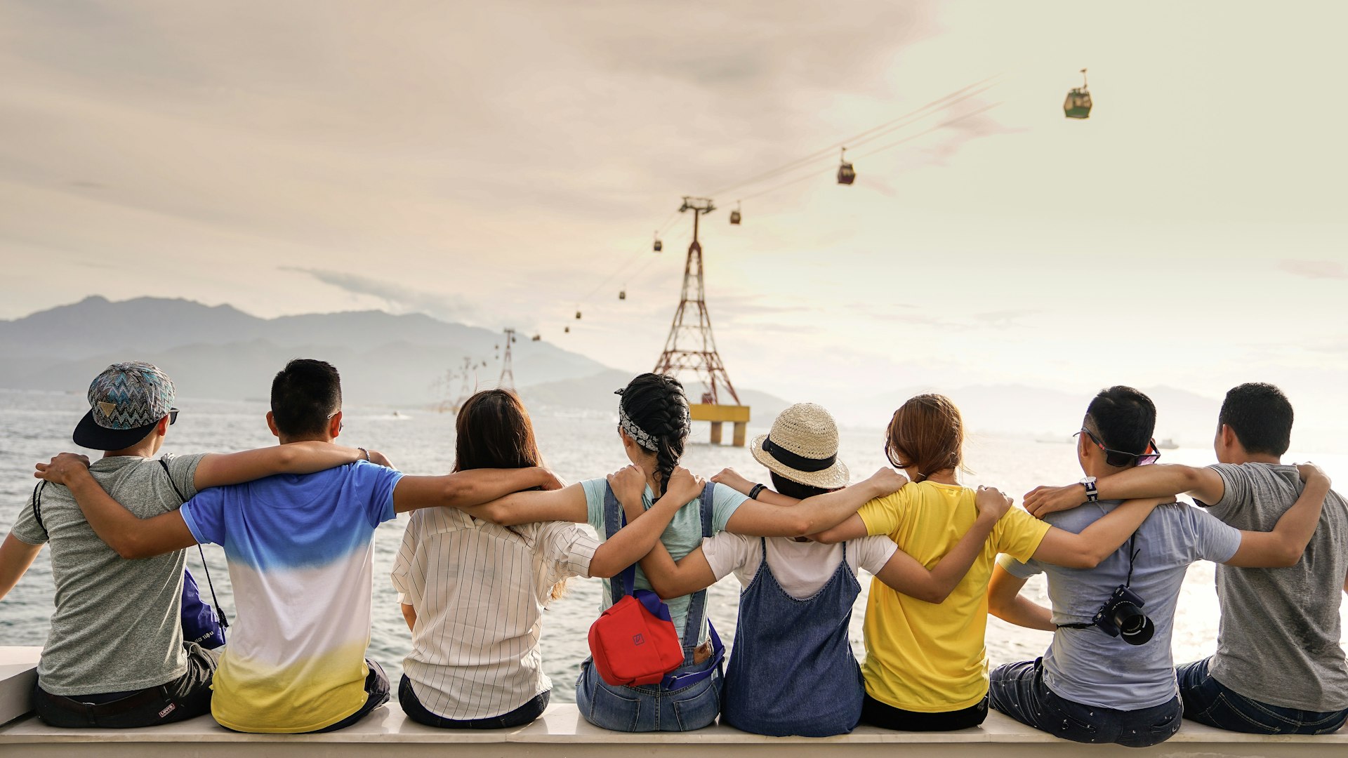Diverse group of friends enjoying life by the water